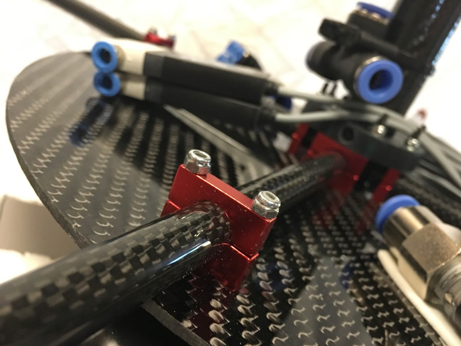 Jet arm outboard bracket (red anodized aluminum)