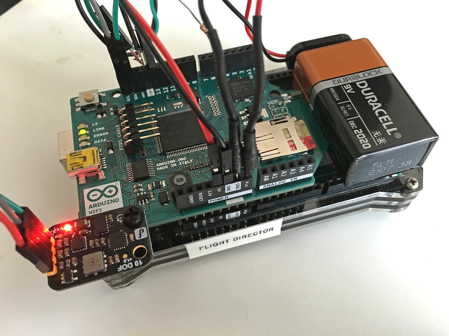 IMU, data logger, web server, and WiFi, plus an audible buzzer and a status LED